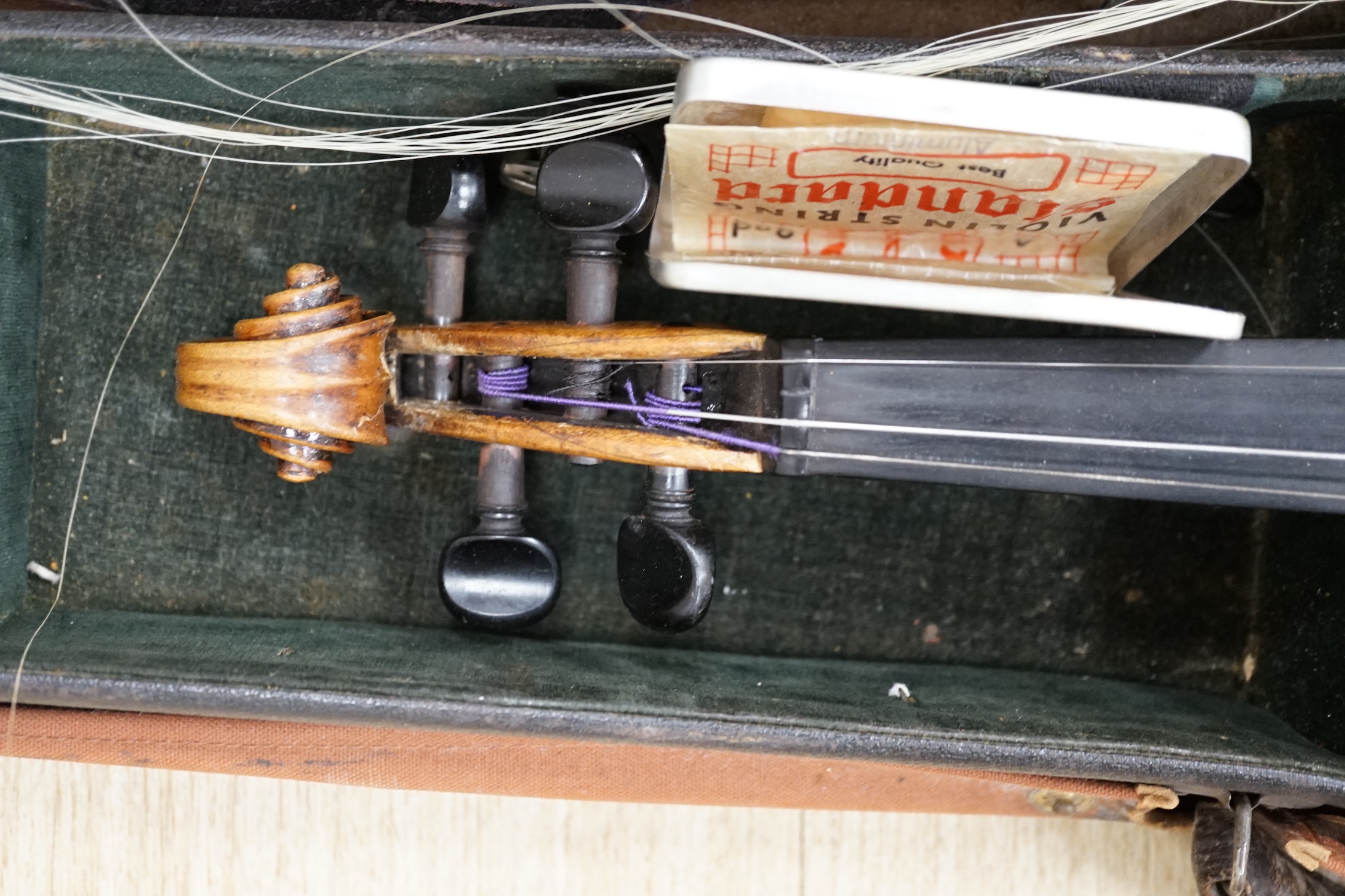 A cased 19th century German violin with paper label for Schweitzer copy Amati Pestini, length of body, 36cm, with bow CITES Submission reference 97BD7MYU